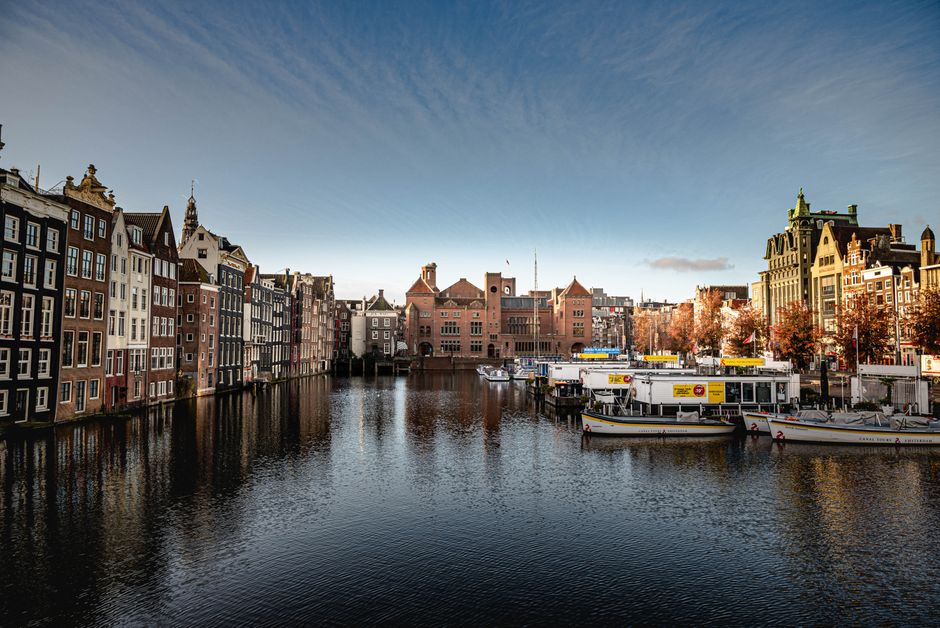 Charming canal view highlighting Amsterdam's historic architecture and picturesque setting.