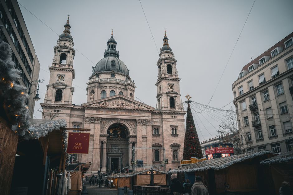 Festive winter scene at St. Stephen's Basilica Christmas Market in Budapest.