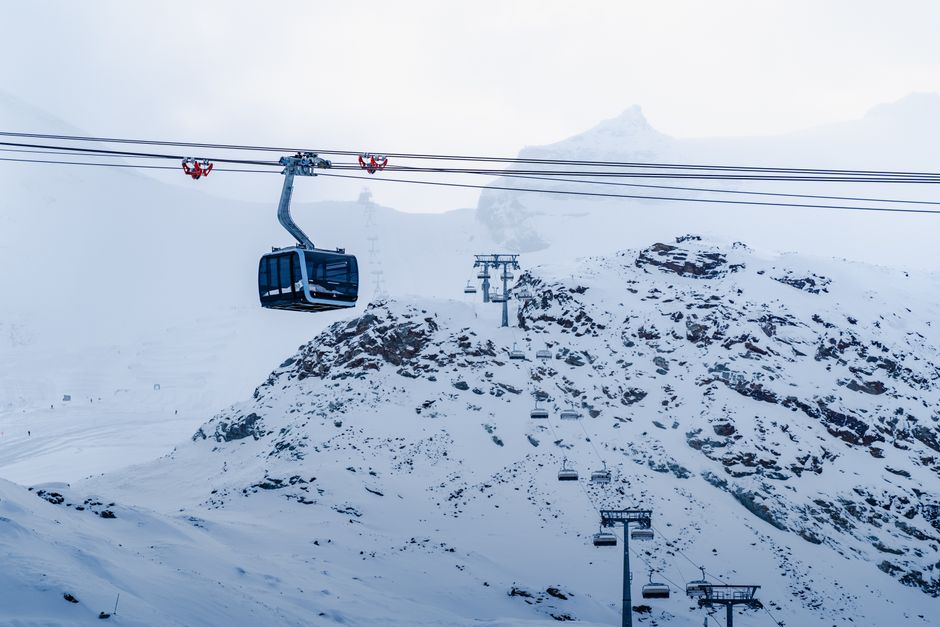 Cable car above snowy slopes in Zermatt in January
