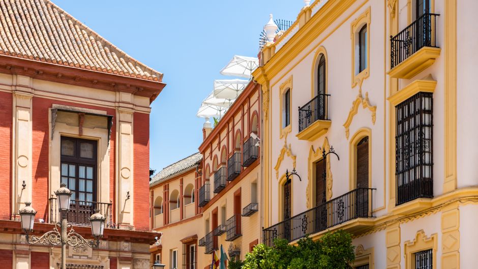 Stunning view of traditional Spanish buildings with vibrant facades in Seville.
