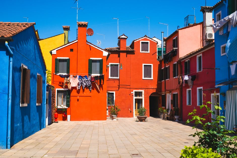 Vibrantly painted houses on Burano Island, Venice during daytime.